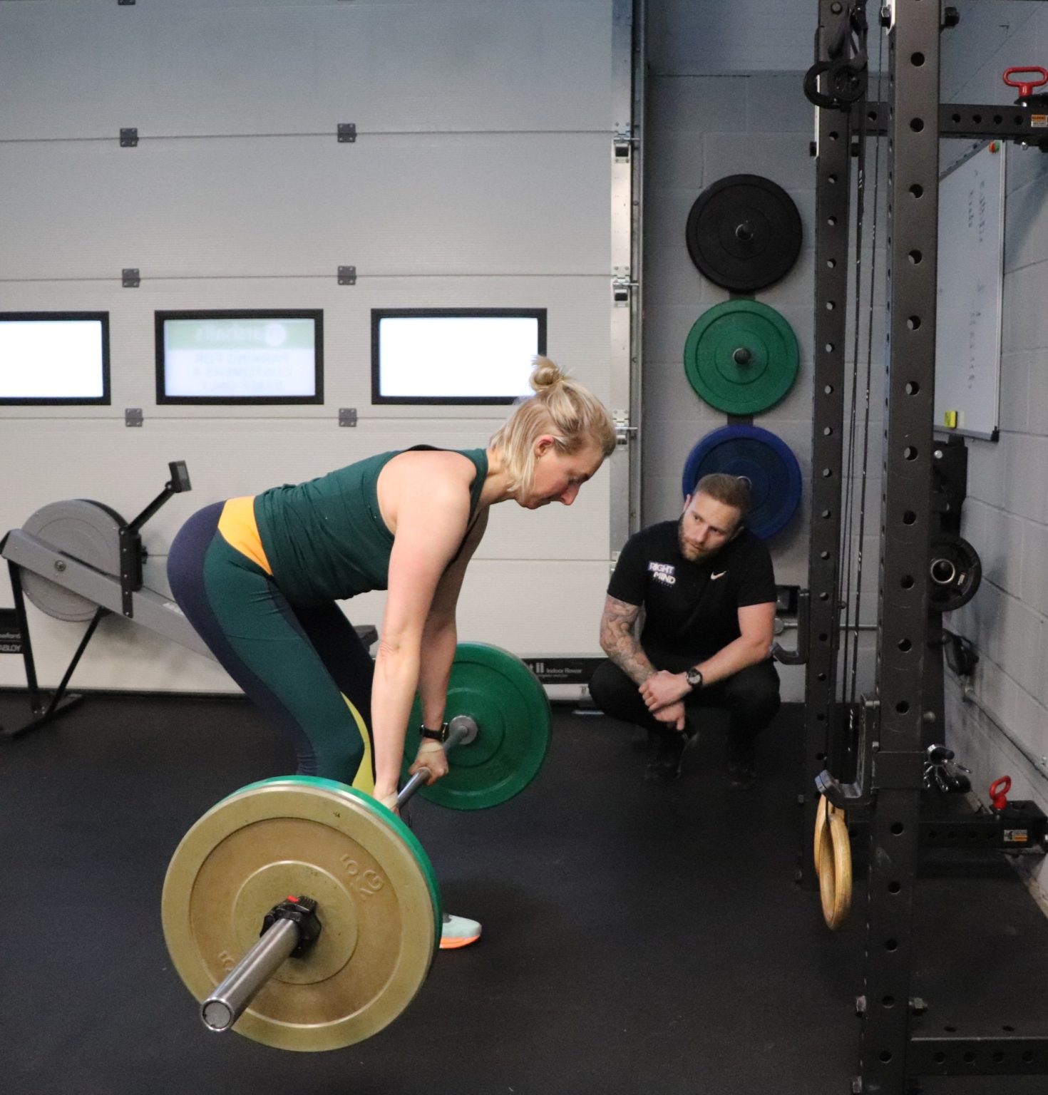 James Bezant coaching a client through a deadlift at his private personal training gym in Chichester